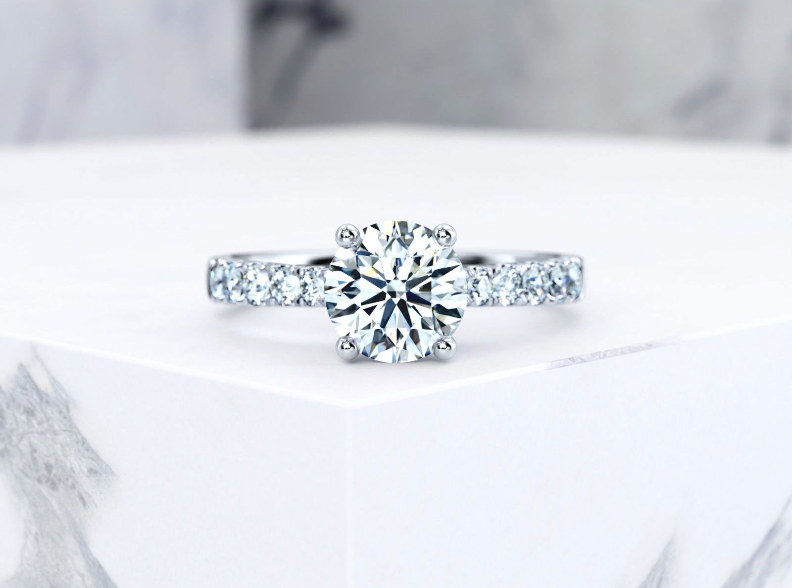 edana_diamond_engagement_ring_on_marble_platinum_round