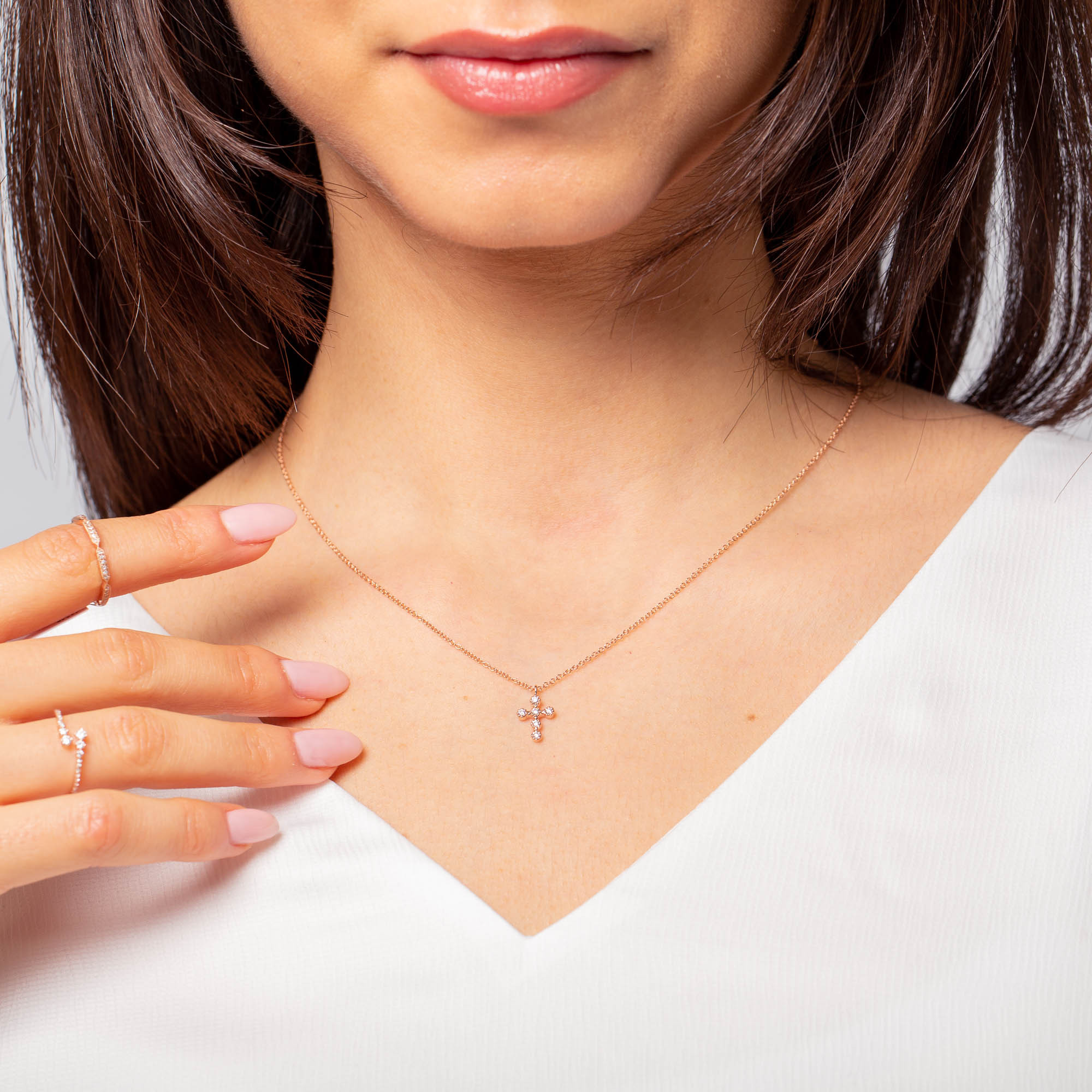 Rose gold and store diamond cross necklace